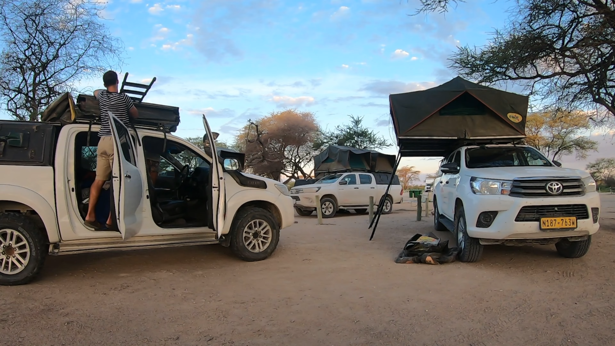 Toyota Hilux 4x4 with rooftop tents parked in the Namib Desert during a 7-Day Self-Drive Namibia Safari